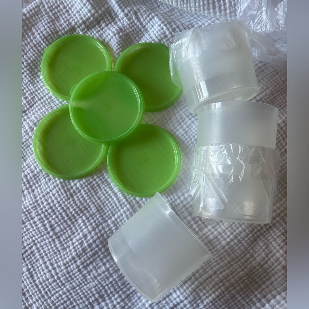 Tupperware containers clear with green lids